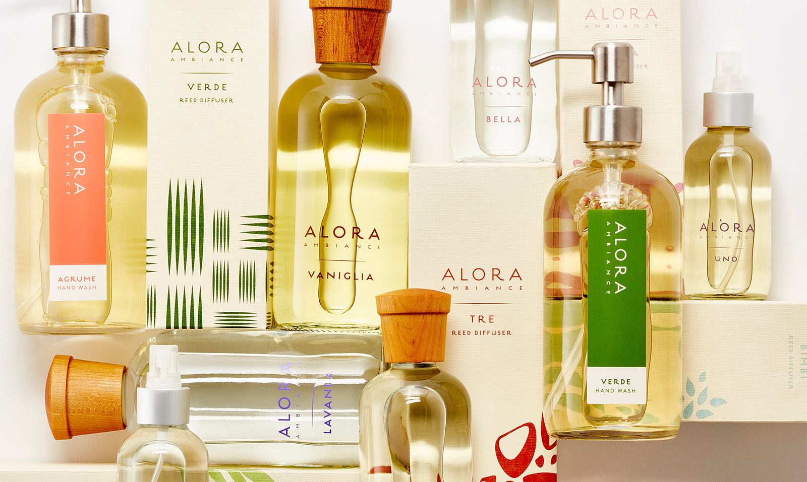 Hand wash bottles, reed diffuser bottles, and room spray bottles laid down in a grid-like pattern