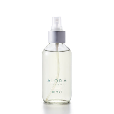 Small glass spray bottle with "Alora Ambiance" and "Bimbi" written on the front.