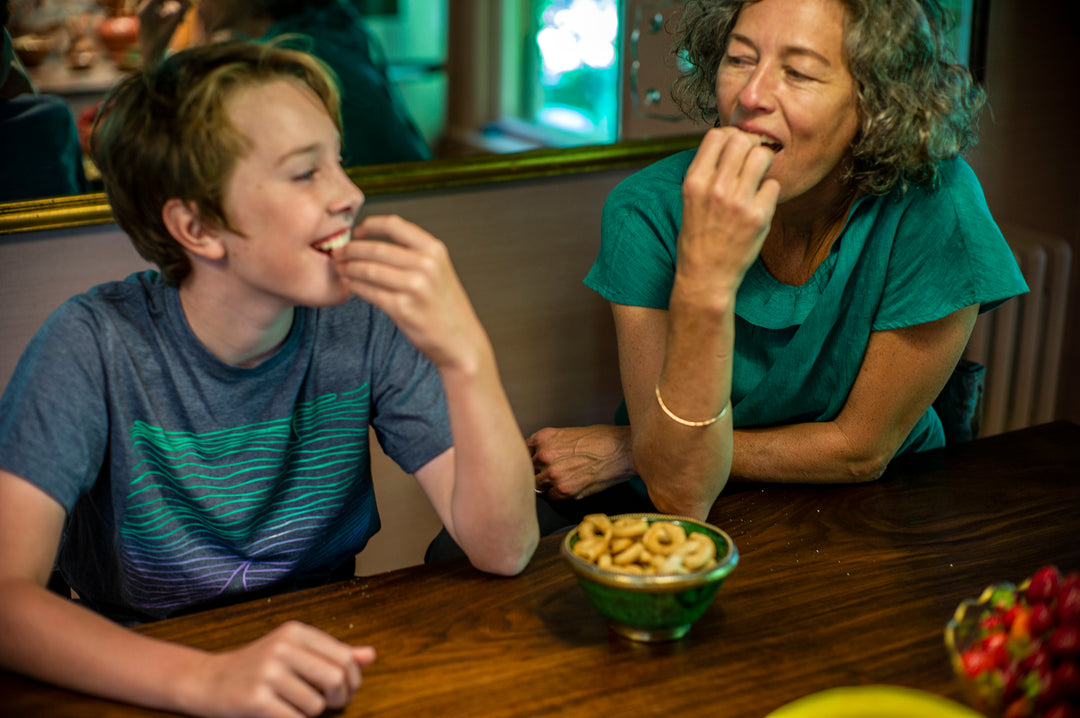 Woman and boy eating taralli