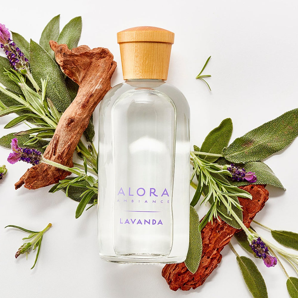 Lavanda diffuser bottle by lavender and sage sprigs and pieces of cedarwood