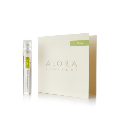 Small clear plastic vial that says “Alora Ambiance” and “Isola” next to a tan card that also says “Alora Ambiance" and “Isola”