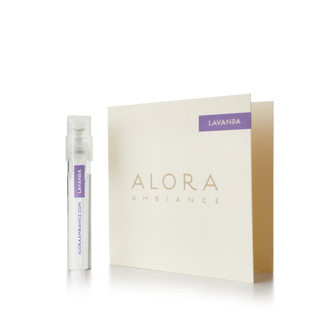 Small clear plastic vial that says “Alora Ambiance” and “Lavanda” next to a tan card that also says “Alora Ambiance" and “Lavanda”